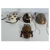 Wall decor masks. 3 ceramic and 1 metal.
