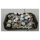 Golf balls and tees. All in used condition.