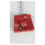 Color Kindler candles, lights the fire, then