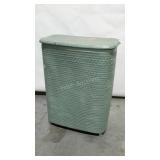 Older wicker laundry hamper, painted green. Some