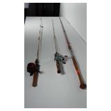 3 older fishing poles. 2 have reels.