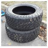 Set of two buck shot two maxxis mudder tires,