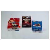 3 small collectable cars: Johnny Lightning Woody,