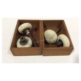 Two wooden boxes with glass doorknobs