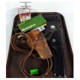 Two holsters and three partial boxes of Remington