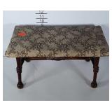 Older solid wood stool. Upholstery shows age and