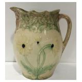 Floral design pottery pitcher