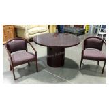 Round conference style table with two chairs