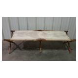 Older folding cot, missing both end stretchers.