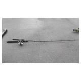 Two fishing poles, one with reel, Shakespeare a