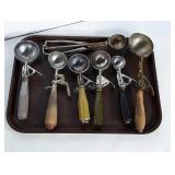 Lot of vintage ice cream scoops.
