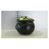 Small plastic cauldron full of green beads and