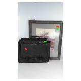 Laptop case and framed photo