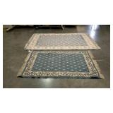 Two blue toned area rugs. Not matching.