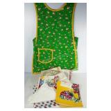 Vintage linens, including an apron, dish towels,