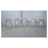 Barn lantern globes.  One is marked RAYO. the