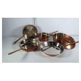 Copper toned cookware with brass handles. All in