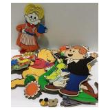 Flat with wooden character cutouts