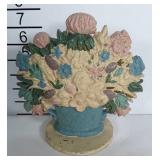 Cast iron flower bouquet door stop.