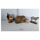 Home decor pieces: ceramic chicken, cat salt