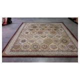 Area rug in burgundy and beige 100% wool pile.