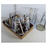 Lot of doll stands. Different sizes.