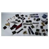 Lot of military patches and pins.