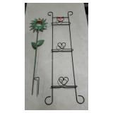 Two metalworks. One yard art and a three