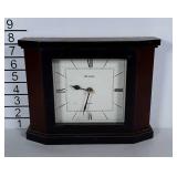 Bulova Mantle clock. Wooden and takes a battery.