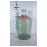 Large blue glass jug. Blemishes around the lip