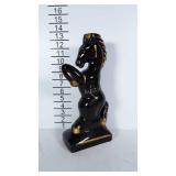 Black horse figure with gold toned detail.