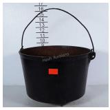 Cast iron kettle with lid. Has rust and crack in