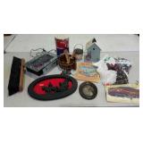 Push broom head, wall plaque, textiles, book,