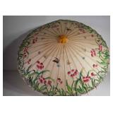 Paper parasol, has a couple of tears