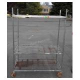 Metal shelving unit on wheels, 65" tall