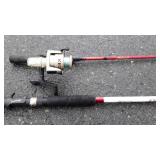 2 fishing poles,  one with reel. Shakespeare