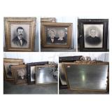 Old framed portraits and old heavy mirror with