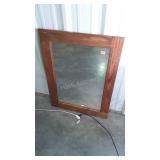 Solid wood framed mirror. Frame has a few scuffs,