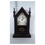 Older wooden mantel clock. Cosmetically in nice
