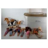 Lots of Barbie fashion dolls with some horses,
