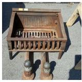 Fireplace log grate with a set of andirons