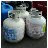 Three propane tanks, grill size empty