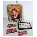 Coca-Cola collectibles: pins, patches and metal