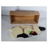 Wooden box and wooden sheep that hangs on wall.