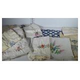 Needlepoint linens and doilies lot. Most show age