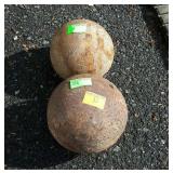 Two cast Shot Put Balls,