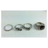Four Sterling silver rings