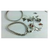 Sterling silver jewelry with bracelets, earrings,