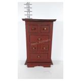 Wooden jewelry box with 6 pull out drawers.