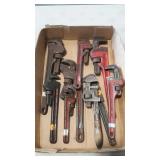 Nine pipe wrenches. Includes several RIGID beand.